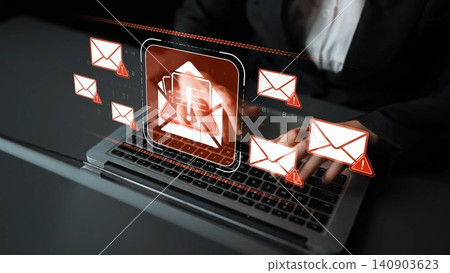 A professional interaction with digital email icons displayed above a laptop in an office setting illustrates modern digital communication and technological connectivity. Sigmoid A professional interaction with digital email icons displayed above a laptop in an office setting illustrates modern digital communication and technological connectivity. Sigmoid 140903623