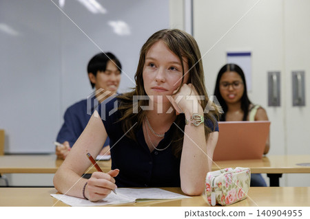 Students studying with foreign instructors at an English conversation school. Students studying with foreign instructors at an English conversation school. 140904955