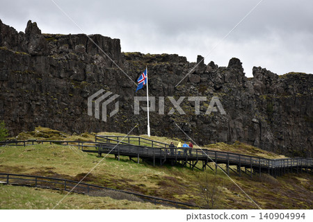 Icelandic flag at Logberg assembly site below Almannagja cliff Icelandic flag at Logberg assembly site below Almannagja cliff 140904994