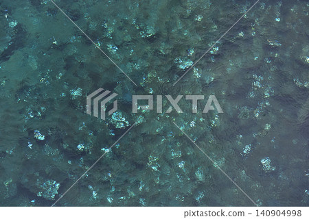 Coins shimmering through clear water at Flosagja fissure Coins shimmering through clear water at Flosagja fissure 140904998