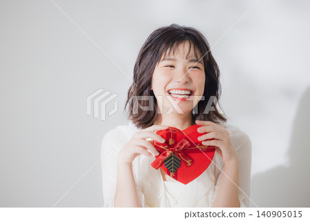 A woman giving a gift A woman giving a gift 140905015