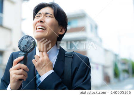 Businessman walking outdoors Businessman walking outdoors 140905166