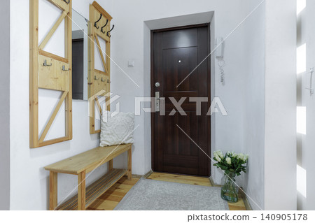 Apartment Entrance Hallway with Wooden Hanger and Mirror Apartment Entrance Hallway with Wooden Hanger and Mirror 140905178