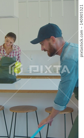 Vertical Video Cleaning service team at work in kitchen. Vertical Video Cleaning service team at work in kitchen. 140905321