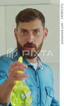 Vertical Video Portrait of man who is ready for housework. Vertical Video Portrait of man who is ready for housework. 140905372