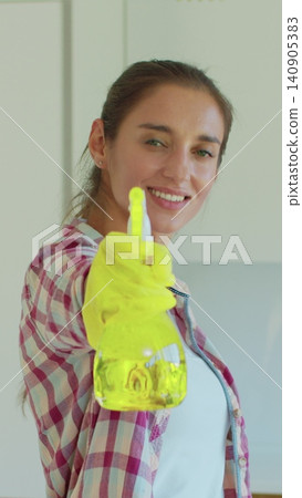 Vertical Video Portrait of housewife who is ready for housework. Vertical Video Portrait of housewife who is ready for housework. 140905383