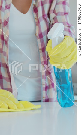Vertical Video Cleaning the kitchen. Housekeeper washes the kitchen table. Vertical Video Cleaning the kitchen. Housekeeper washes the kitchen table. 140905509