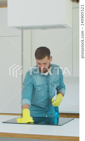 Vertical Video Cleaning service team man and woman at work in kitchen. Vertical Video Cleaning service team man and woman at work in kitchen. 140905521