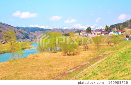 The Chikuma River flows through the lush greenery of northern Nagano Prefecture in early spring. The Chikuma River flows through the lush greenery of northern Nagano Prefecture in early spring. 140905726