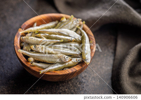 Bowl Of Fresh Small Fish On Wooden Bowl Rustic Seafood Ingredients For Cooking Bowl Of Fresh Small Fish On Wooden Bowl Rustic Seafood Ingredients For Cooking 140906606