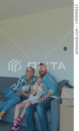Vertical Video Happy family with cardboard boxes in new house at moving day. Vertical Video Happy family with cardboard boxes in new house at moving day. 140906813