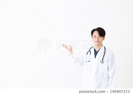 Middle-aged male doctor wearing a white coat Middle-aged male doctor wearing a white coat 140907253