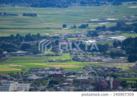 A view overlooking the rice fields and townscape of the Aso caldera. A view overlooking the rice fields and townscape of the Aso caldera. 140907309