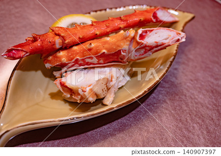 King crab legs served on a plate King crab legs served on a plate 140907397