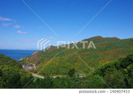 A view of the Chogo area from the Kaikyo Line in Sai Village, Aomori Prefecture, with Hakodate City and Mount Hakodate in the distance. A view of the Chogo area from the Kaikyo Line in Sai Village, Aomori Prefecture, with Hakodate City and Mount Hakodate in the distance. 140907453