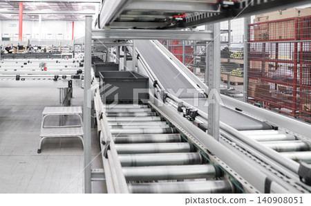 packing line in a logistics warehouse. conveyor belt in a modern production line. Pallet racking 140908051
