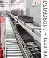 packing line in a logistics warehouse. conveyor belt in a modern production line. Pallet racking 140908058