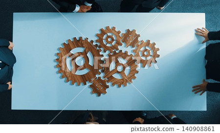 Top view of business people gather wooden cog together at meeting. Directorate. Top view of business people gather wooden cog together at meeting. Directorate. 140908861