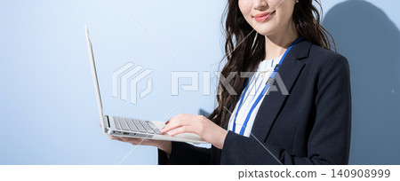 A banner image shows a smiling Japanese businesswoman holding a laptop against a light blue background, with her face obscured. A banner image shows a smiling Japanese businesswoman holding a laptop against a light blue background, with her face obscured. 140908999