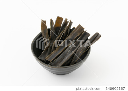 Chewing kelp in a small bowl against a white background. Chewing kelp in a small bowl against a white background. 140909167