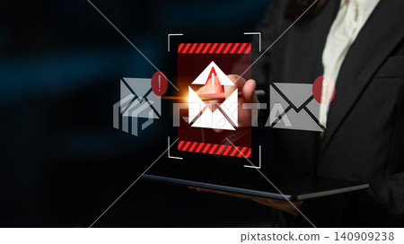 Business person holding tablet with digital email security alert concept, warning of phishing attempts and cyber threats to online communications and data protection Gantry Business person holding tablet with digital email security alert concept, warning of phishing attempts and cyber threats to online communications and data protection Gantry 140909238
