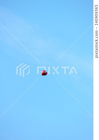Solitary Red Heart Balloon in Blue Sky - Symbol of Love and Freedom Solitary Red Heart Balloon in Blue Sky - Symbol of Love and Freedom 140909365