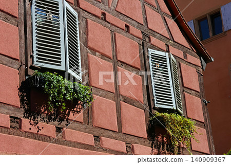 Rustic Charm of Timbered House with Shuttered Windows and Flower Boxes Rustic Charm of Timbered House with Shuttered Windows and Flower Boxes 140909367