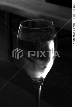 Elegant Wine Glass in Black and White - Sophisticated Dining Ambiance Elegant Wine Glass in Black and White - Sophisticated Dining Ambiance 140909368