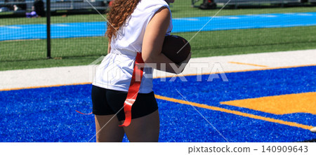 Girl Scores a Touchdown During Flag Football Game Girl Scores a Touchdown During Flag Football Game 140909643
