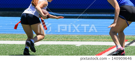 Players Engage in Flag Football Game at Local Field During Summer Players Engage in Flag Football Game at Local Field During Summer 140909646