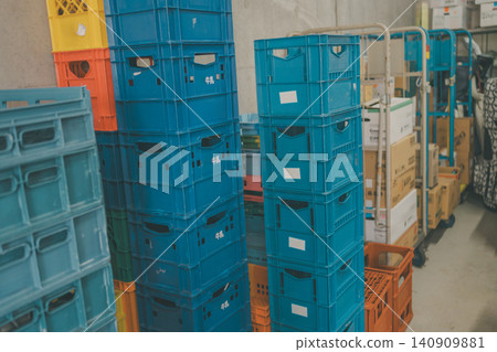 Milk crates stacked in the back room of a supermarket Milk crates stacked in the back room of a supermarket 140909881