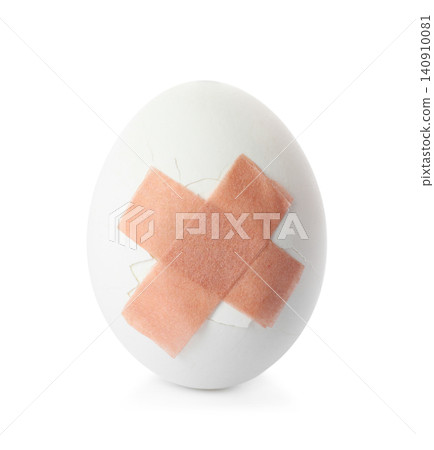 Cracked egg with sticking plasters isolated on white Cracked egg with sticking plasters isolated on white 140910081