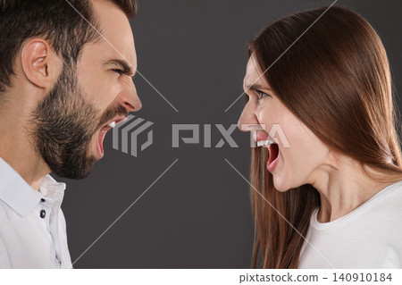 Couple quarreling on black background, closeup. Relationship problems Couple quarreling on black background, closeup. Relationship problems 140910184