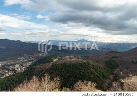 High angle view of a wide mountain valley under cloudy sky in Abruzzo region High angle view of a wide mountain valley under cloudy sky in Abruzzo region 140910595