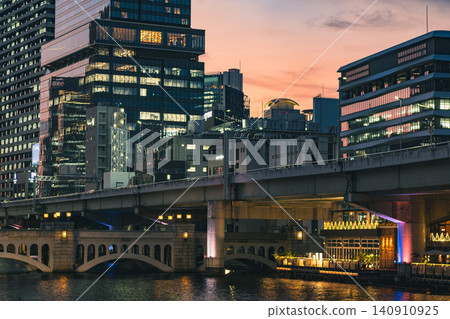 City sunset and night view of the waterfront: bridges and buildings City sunset and night view of the waterfront: bridges and buildings 140910925