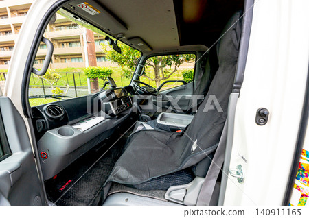 The driver's seat and interior space of a campervan The driver's seat and interior space of a campervan 140911165