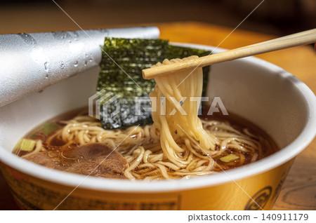 The noodles of instant ramen that you lift with chopsticks The noodles of instant ramen that you lift with chopsticks 140911179