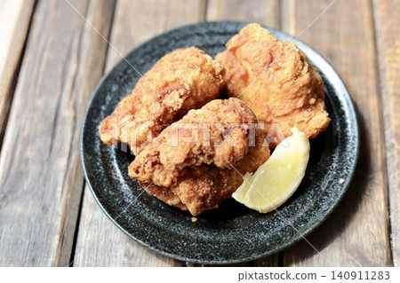 Large, crispy and juicy fried chicken thighs Large, crispy and juicy fried chicken thighs 140911283