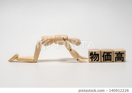 A drawing mannequin dejected and disheartened by rising prices. 140912226