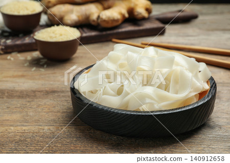 Tasty rice noodles on wooden table, closeup Tasty rice noodles on wooden table, closeup 140912658