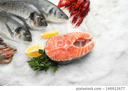 Fresh fish and different seafood on ice Fresh fish and different seafood on ice 140912677