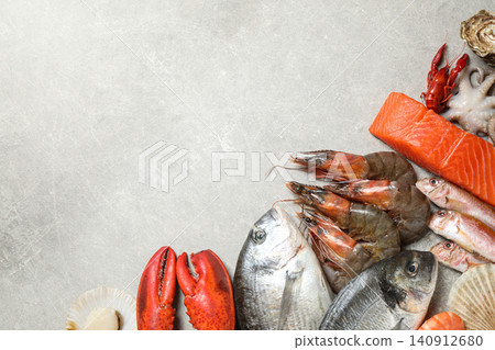 Fresh fish and seafood on marble table, flat lay. Space for text Fresh fish and seafood on marble table, flat lay. Space for text 140912680