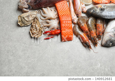 Fresh fish and seafood on marble table, flat lay. Space for text Fresh fish and seafood on marble table, flat lay. Space for text 140912681