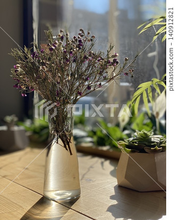 Wildflower Bouquet in Glass Vase Illuminated by Morning Sunlight 140912821