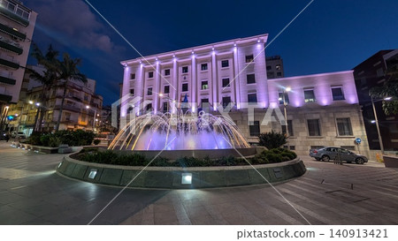 An illuminated fountain in a plaza in the city An illuminated fountain in a plaza in the city 140913421