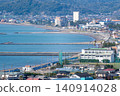A view of the coastline townscape from a hilltop. 140914028
