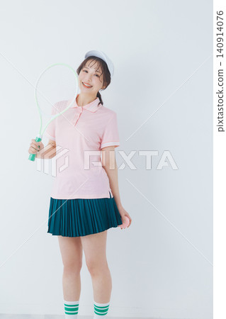 young woman in tennis attire young woman in tennis attire 140914076