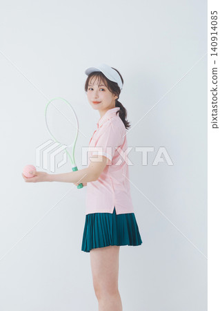 young woman in tennis attire young woman in tennis attire 140914085