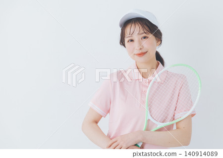 young woman in tennis attire 140914089