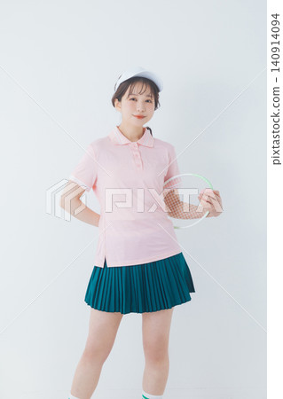 young woman in tennis attire young woman in tennis attire 140914094
